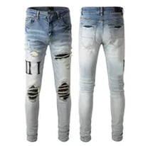 light blue letters ripped jeans