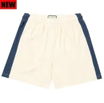 white and blue shorts