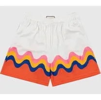 white and orange short pants