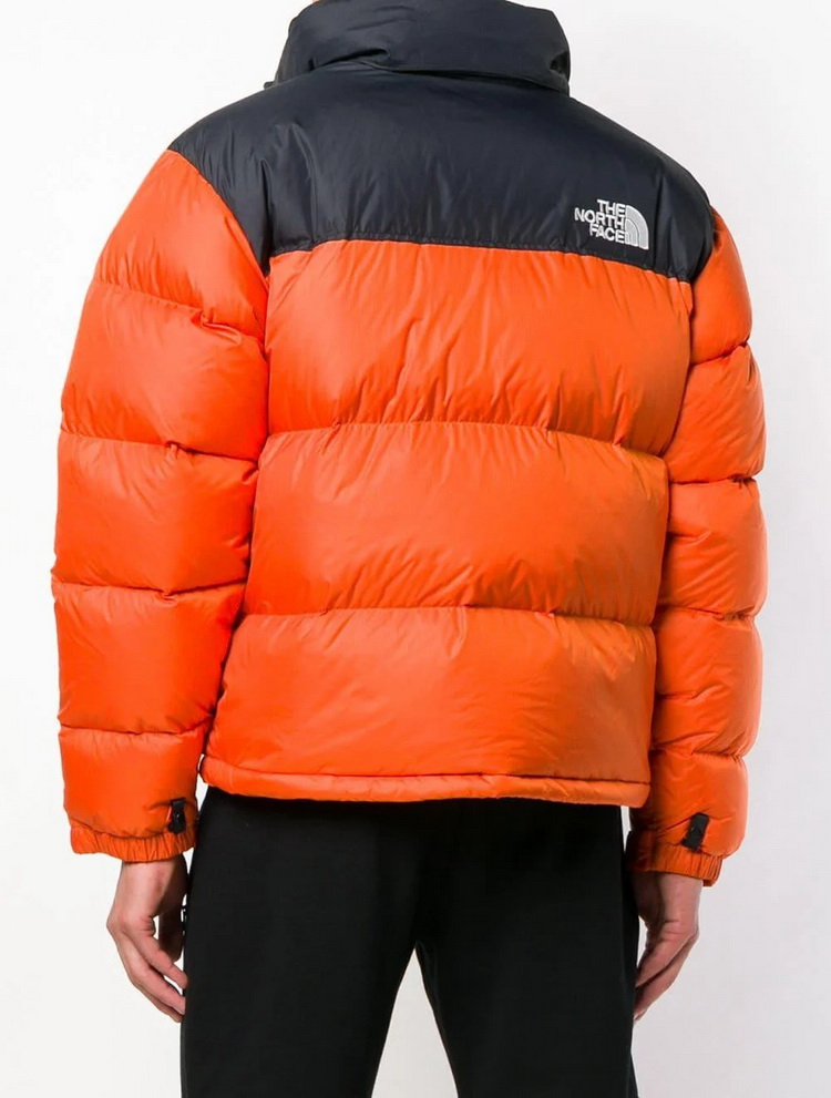 orange puffer jacket black top