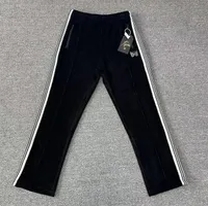 black track pants white stripe