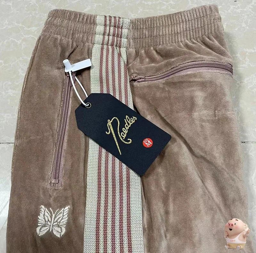 beige track pants men